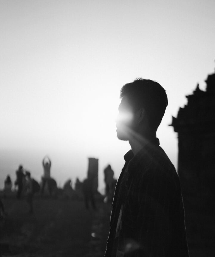 Man Standing Near People